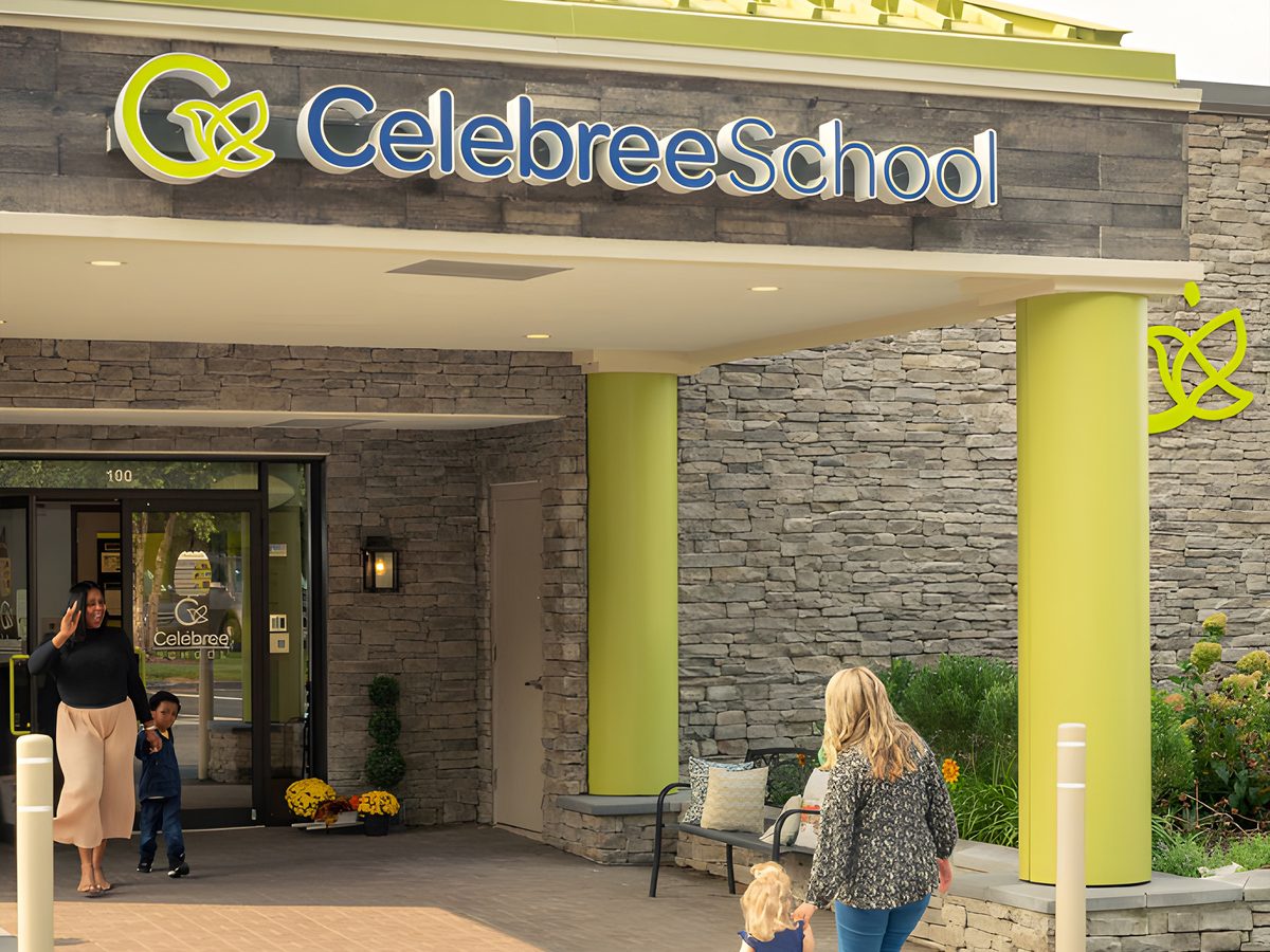 Celebree School entrance with school signage and families